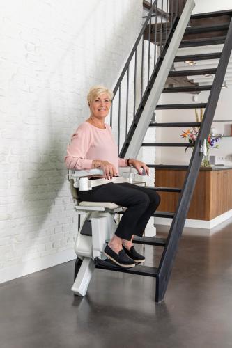 handicare-1100-woman-stairlift-posing-2